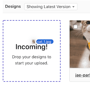 Uploading a new design by dragging and dropping it onto the issue page.